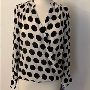 INC large white and black polka dot blouse.